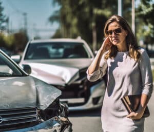 Woman walking away from a car accident